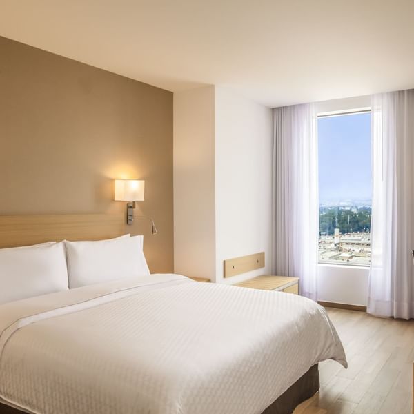 Interior of Junior Suite with king bed at Fiesta Inn