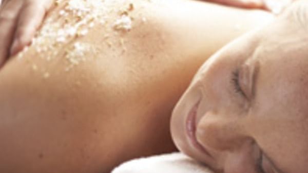 Woman undergoing scrub treatment in spa at Novotel Barossa