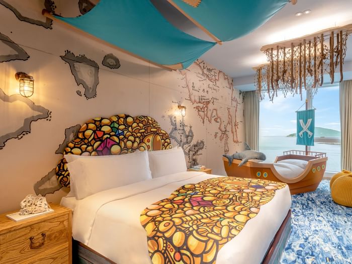 Comfy bed and lounge in Pirate Paradise Room at Fullerton Ocean Park Hotel Hong Kong