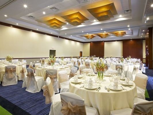 ballroom with circular tables and chairs