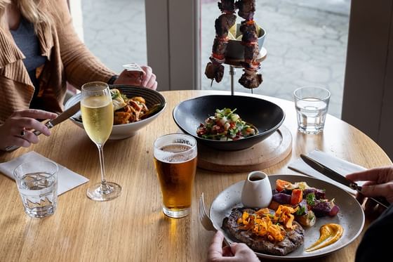 A couple enjoys a meal together in Hamer’s Bar & Bistro at Strahan Village