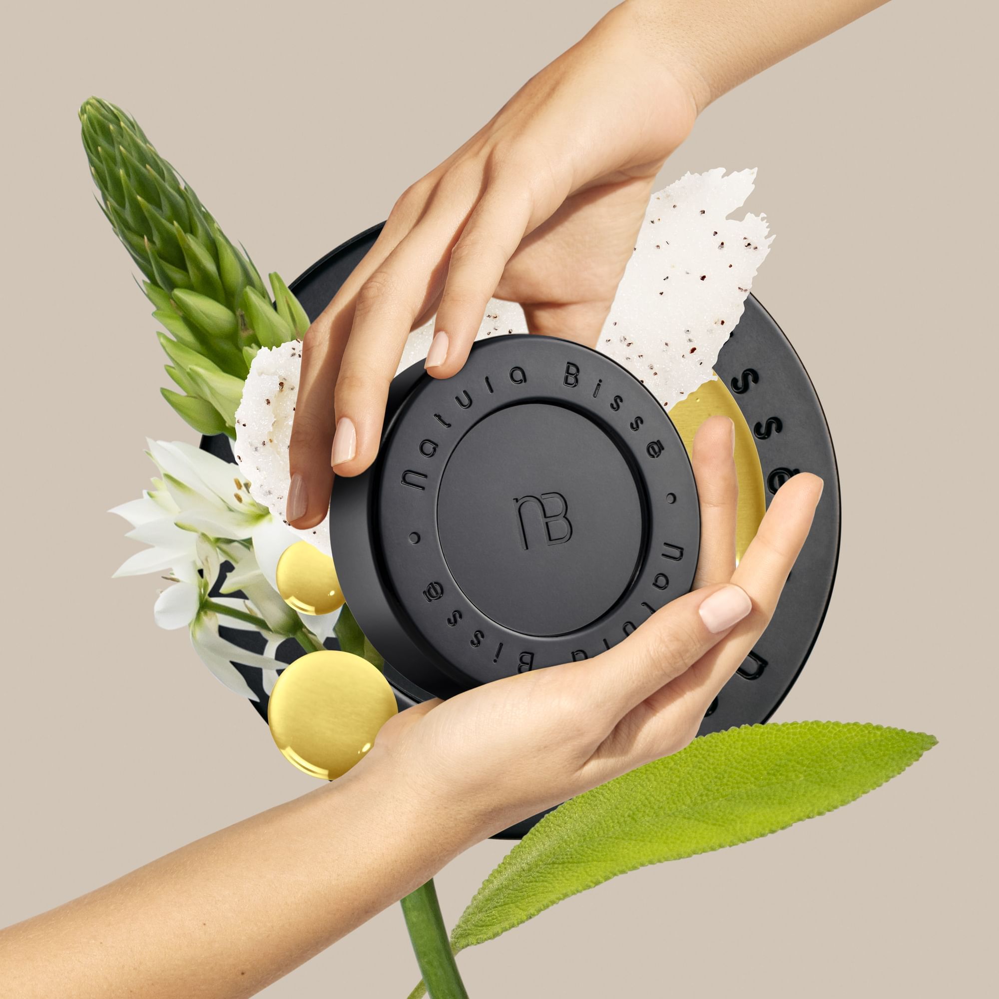 Closeup of hands holding black lid product at Marquis Los Cabos