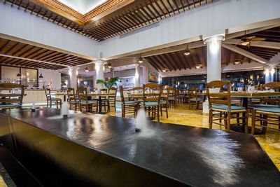 Indoor water pond in a restaurant at Buenaventura Grand Hotel