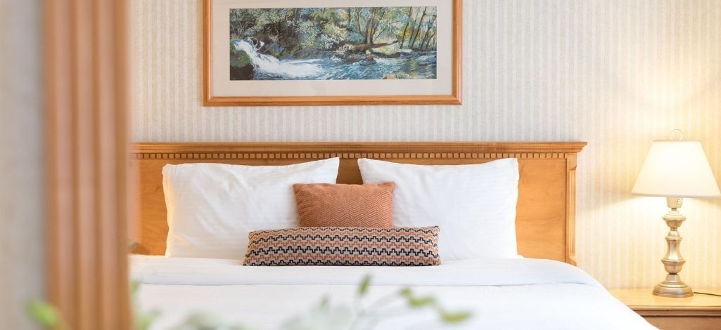 Guest room with a king bed at Listel Whistler, a Coast Hotel