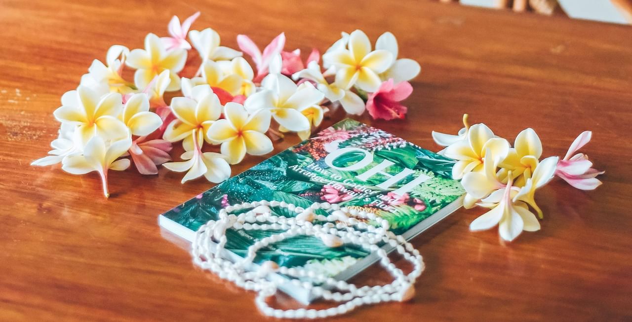 Book and flowers on the table
