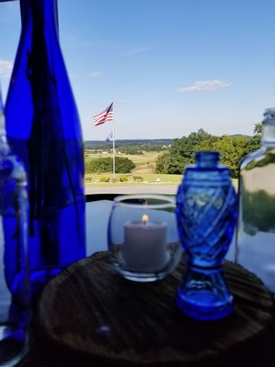 Glass bottle and candle overlooking Gettysburg.