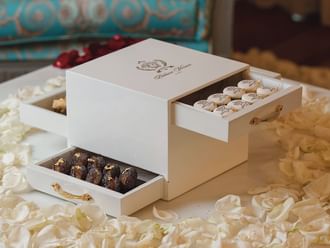 Close-up of a multi-layer sweet box at Palazzo Versace Dubai