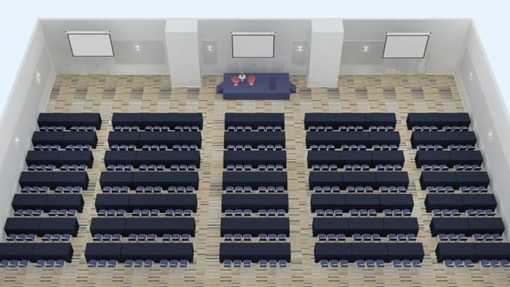 Illustration of Freshwater Ballroom with classroom set-up, stage, and patterned floor at Novotel Sydney Olympic Park