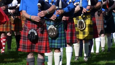Group of bagpipers in traditional Scottish kilts near Blackstone Mountain Lodge