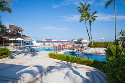 Outdoor pool with restaurent & ocean view at Buenaventura Grand