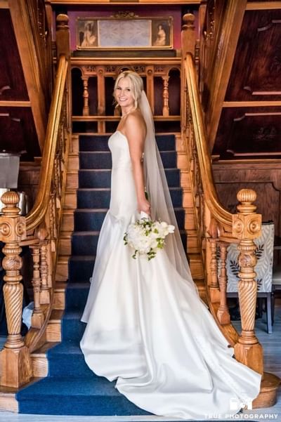 Portrait of a bride on the staircase at Horton Grand Hotel