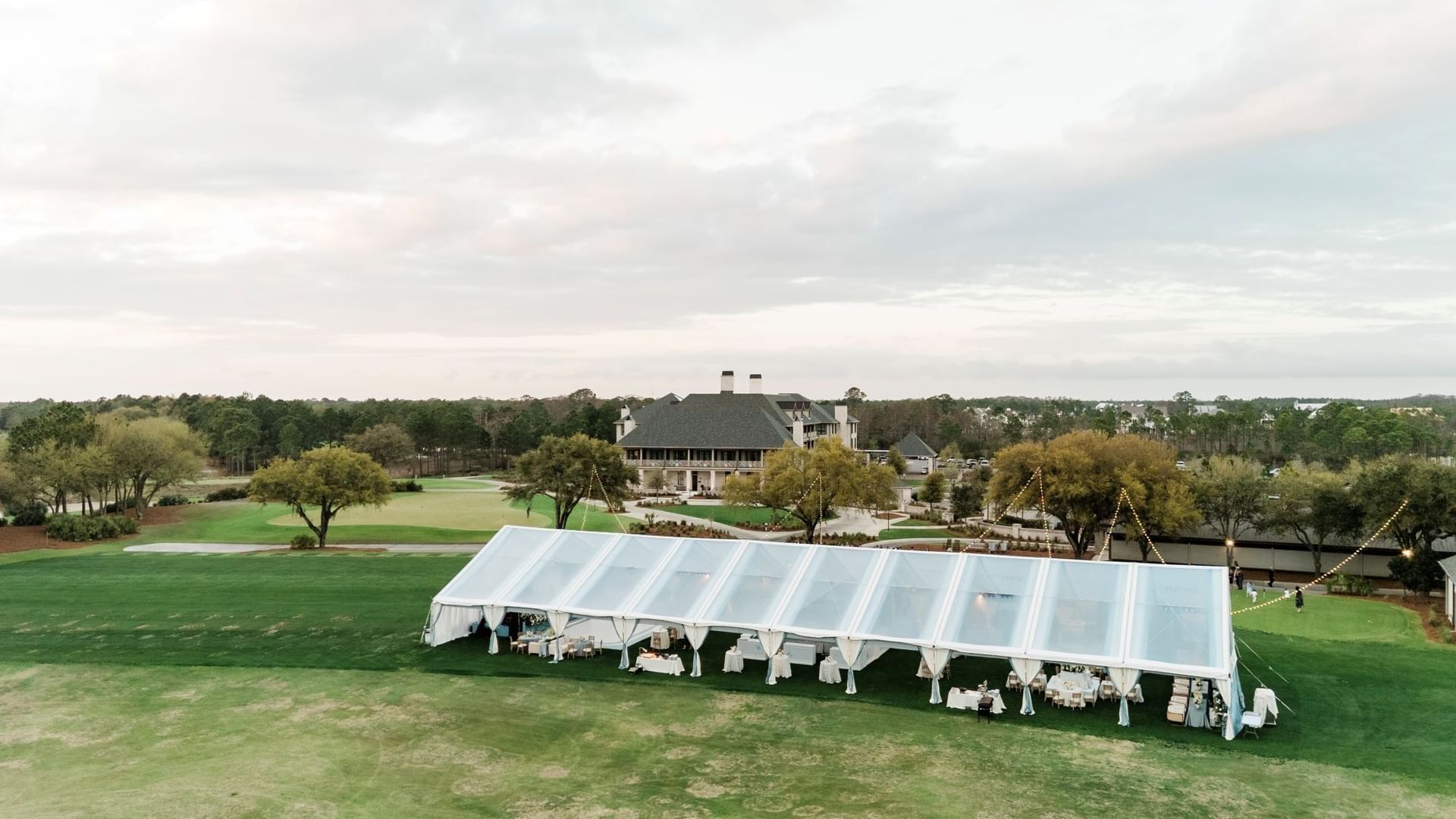 Tented event space on a golf course at Camp Creek Driving Range in Inlet Beach.