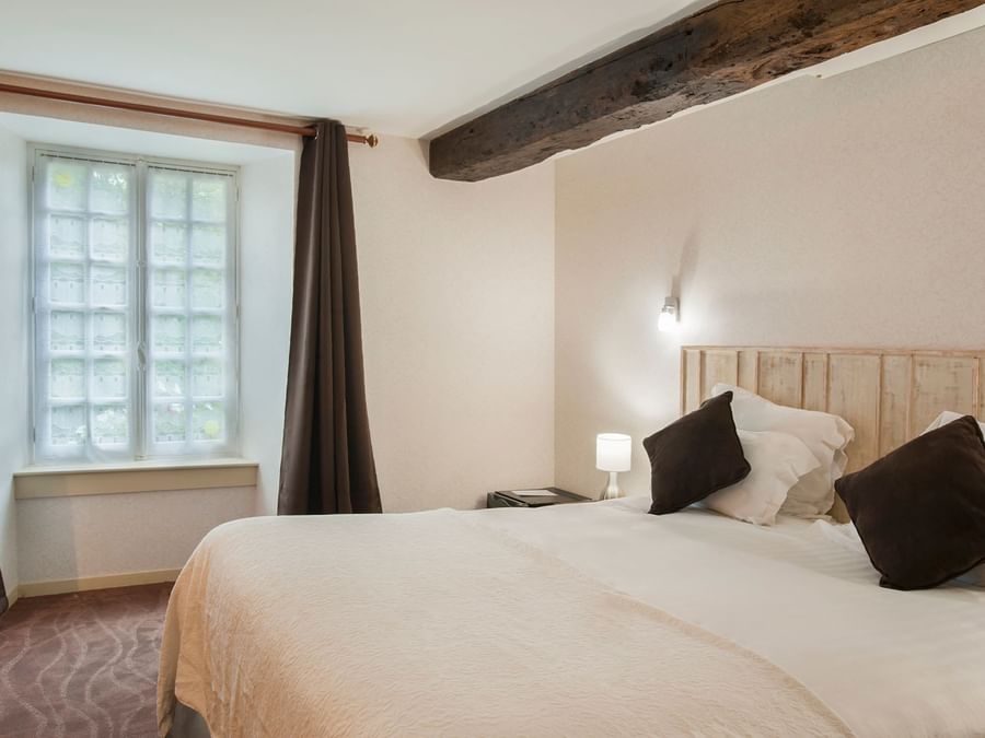 Interior of a comfortable bedroom at Manoir de la Roche Torin