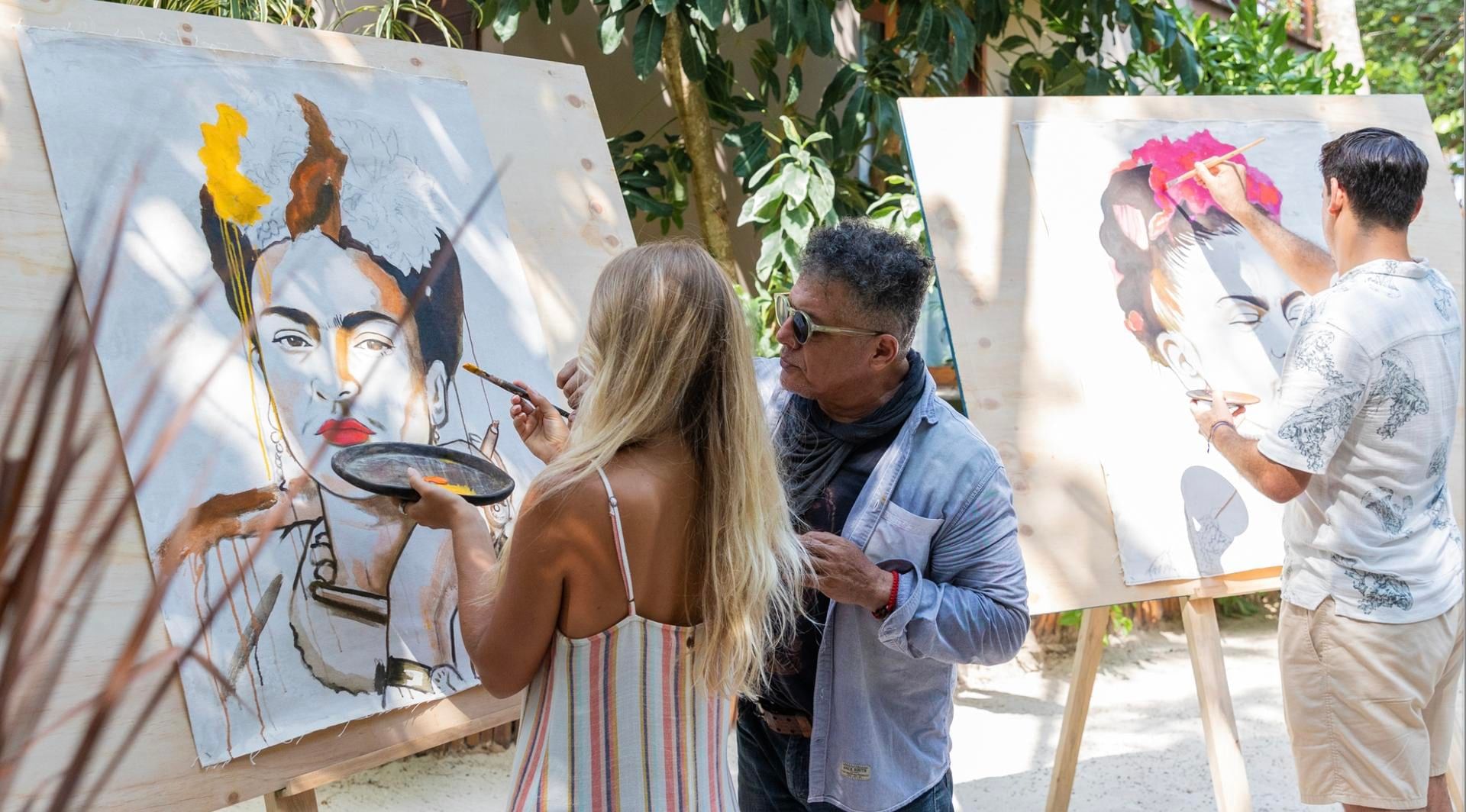 Guests painting colorful portraits with an instructor during Studio de Color at La Zebra
