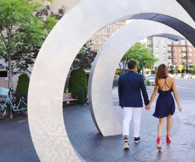 A beautifully dressed couple walking on the road at Hotel 43
