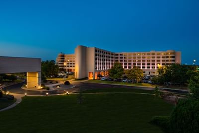 Exterior view at night of NCED Hotel and Conference Center