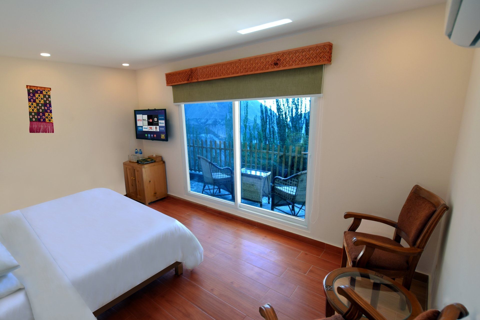 Interior of a hut with twin beds at Serena Altit Fort