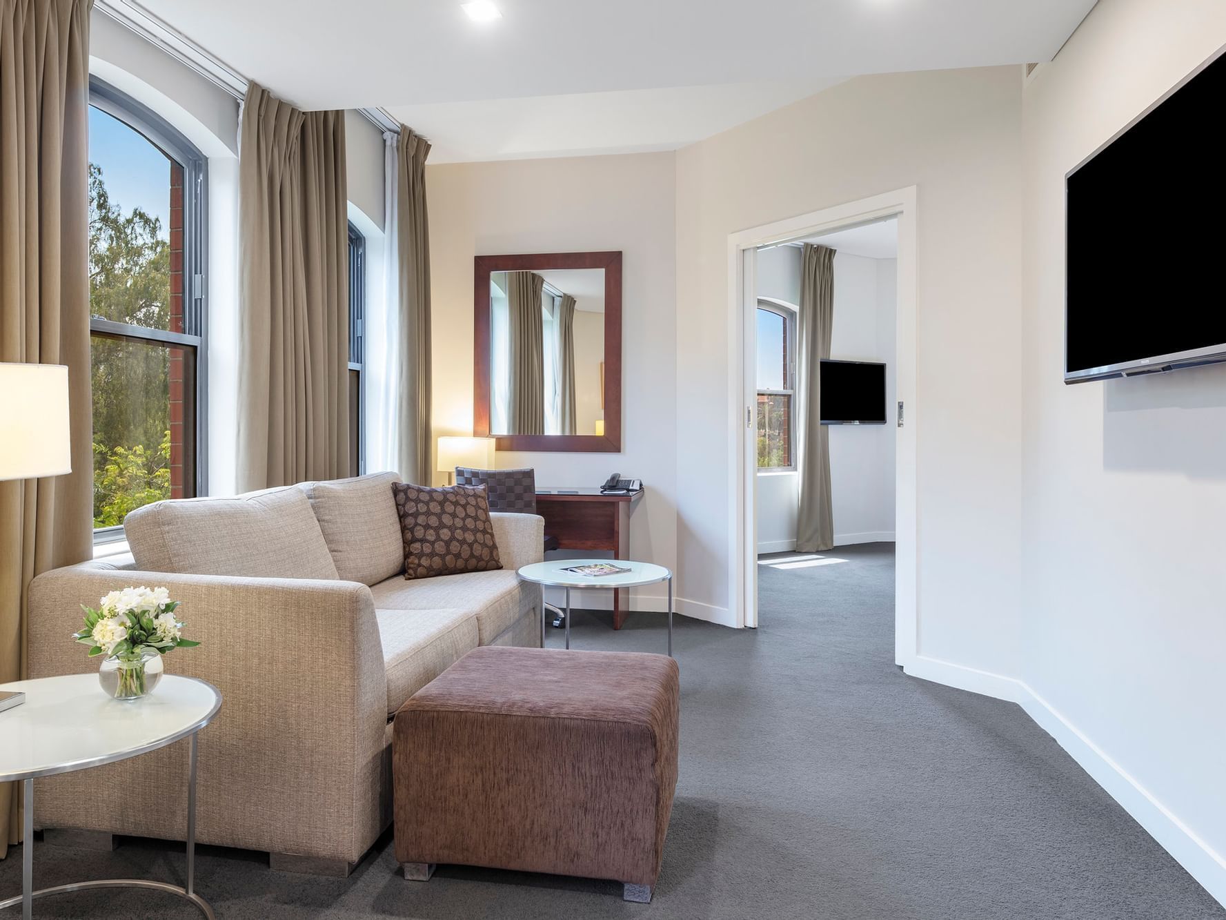 Living area in Superior Riverview Spa Suite at Amora Hotel