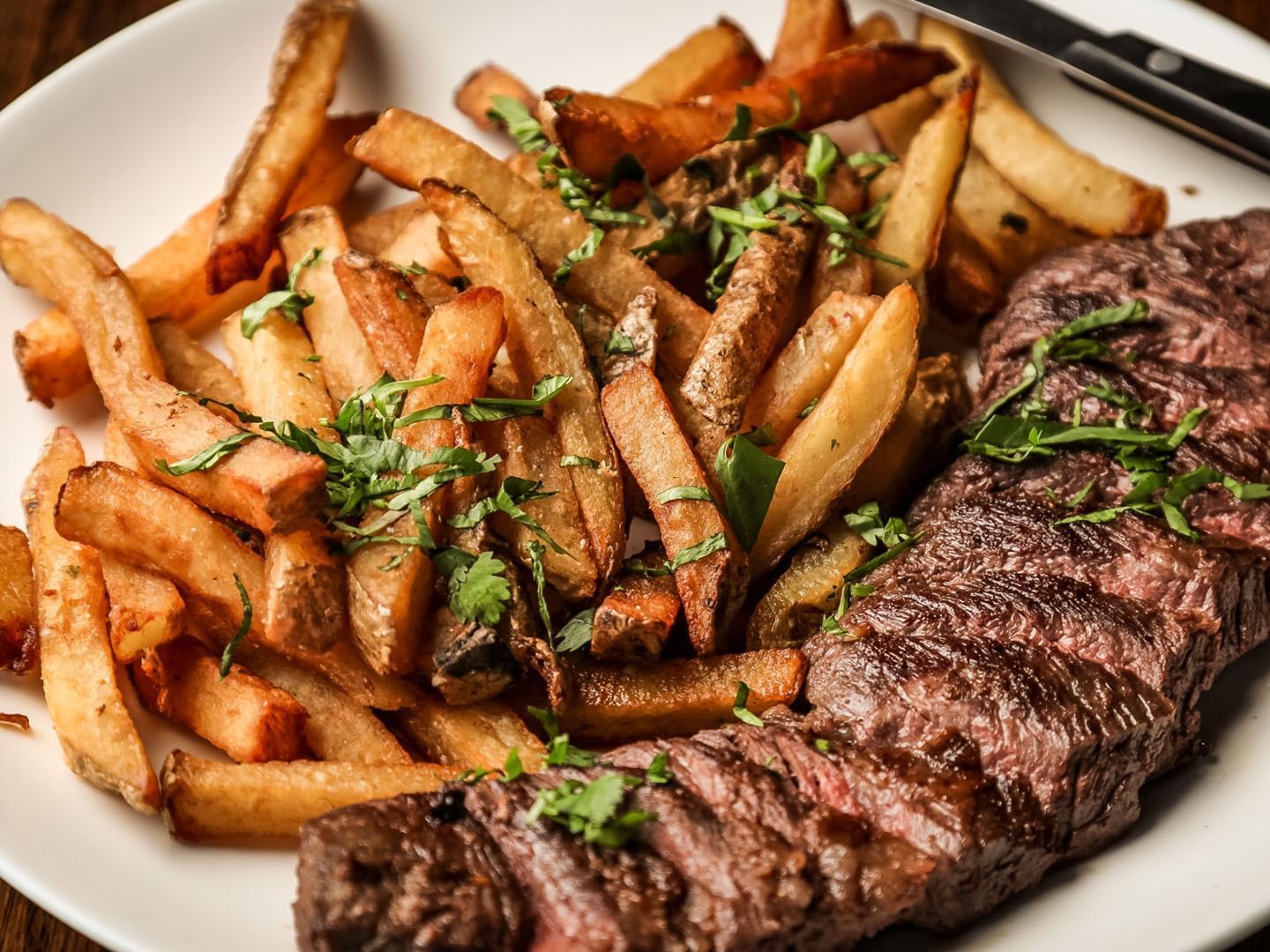 Close-up of a stake & fries dish served at Music Road Resort
