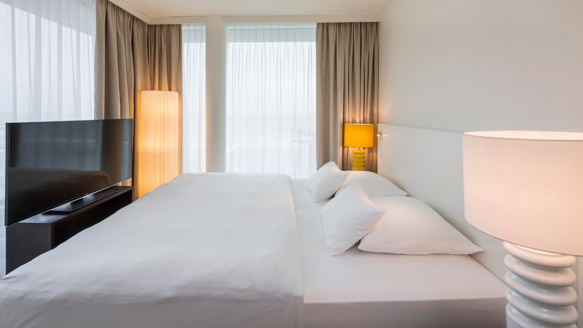 Large bed, Seaside Penthouse sea view at Falkensteiner Hotels