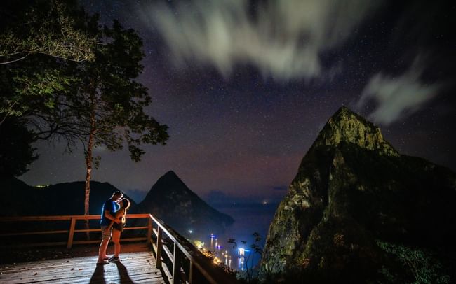A couple hugging each other in the viewpoint at Ladera Resort in nighttime