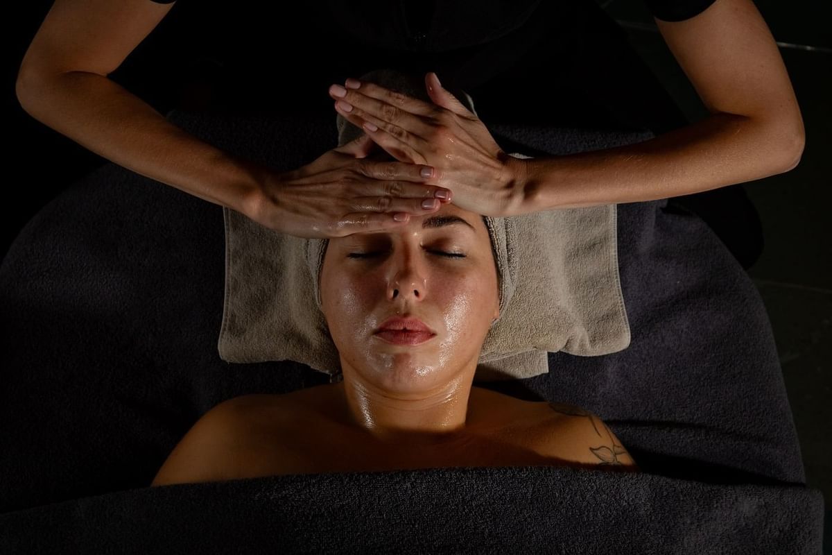 A woman relaxes during a professional facial treatment at The May Fair Spa, The May Fair Hotel