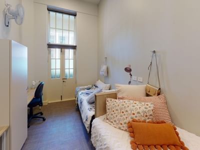 Twin Room with two beds, two desks and balcony at UniLodge Herston.