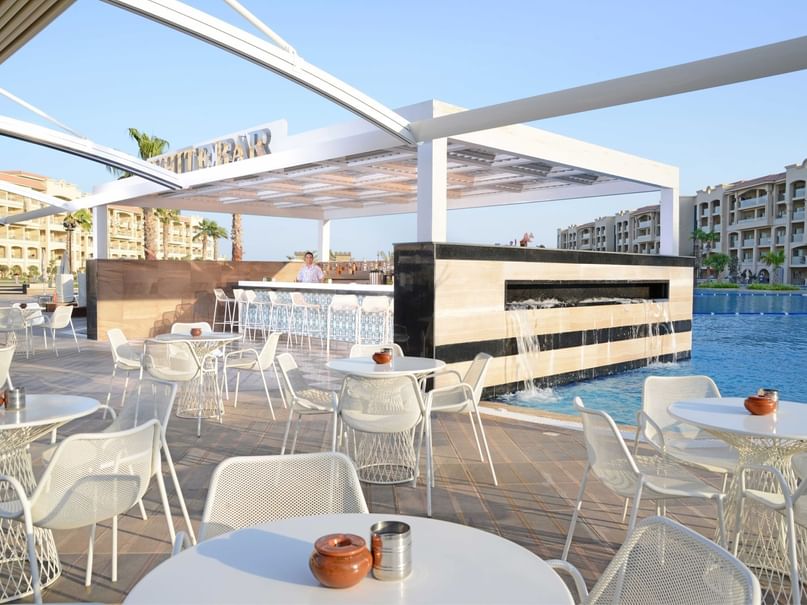 Exterior view of white bar table set up at pickalbatros hotels