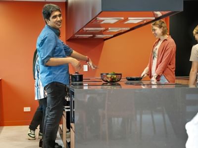 UniLodge Auckland Central Students Enjoying the cooking facilities.