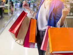 Woman holding several shopping bags