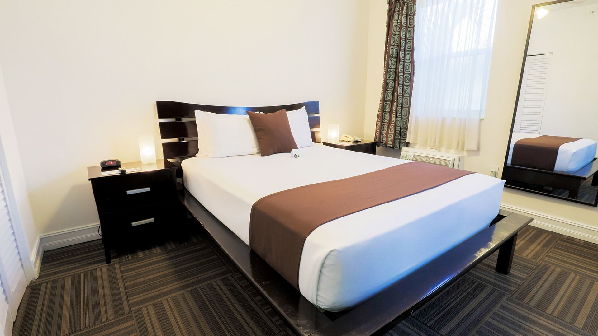 Interior of the Queen Studio room with a King bed at DOT Hotels