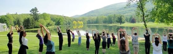 People yoga in a park near Honor’s Haven Retreat