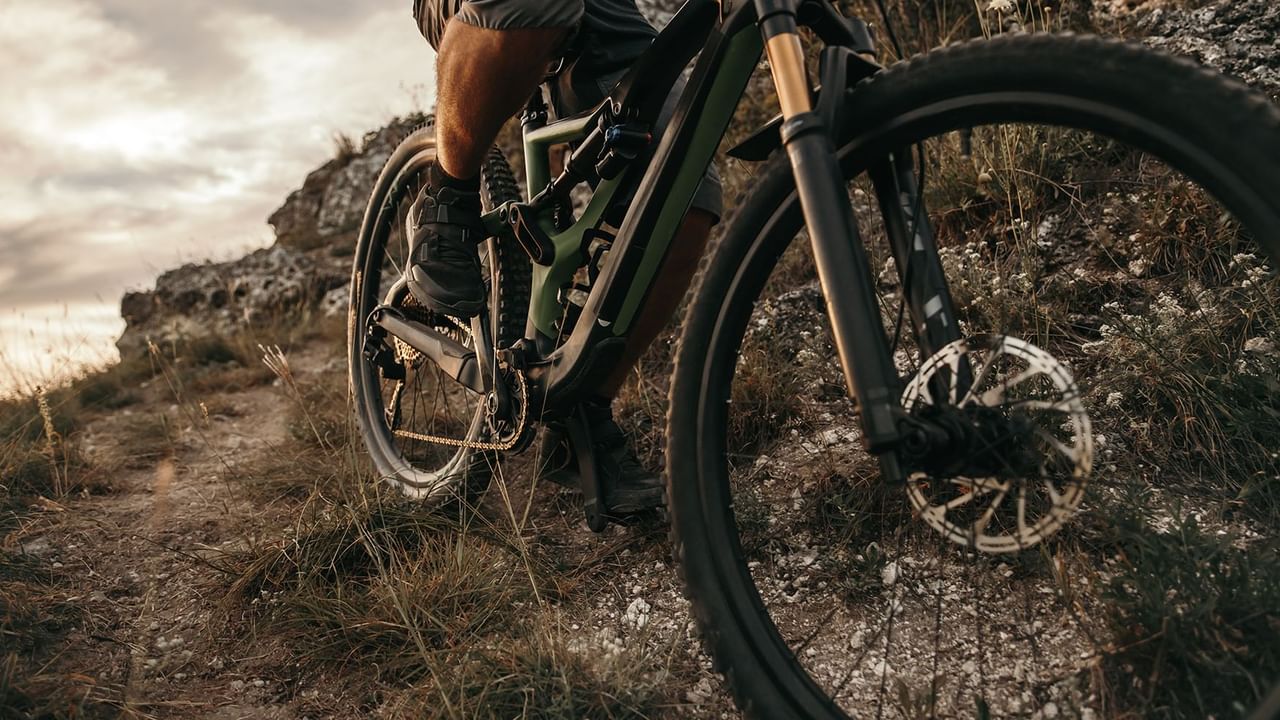 Close-up of a mountain bike and rider near Coast Hinton Hotel