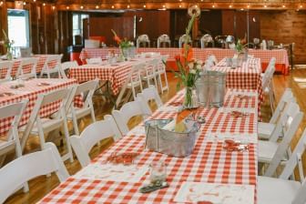 Tables with plaid design cloth & decor for a wedding ceremony at Sebasco Harbor Resort