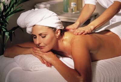 Woman receiving body massage.