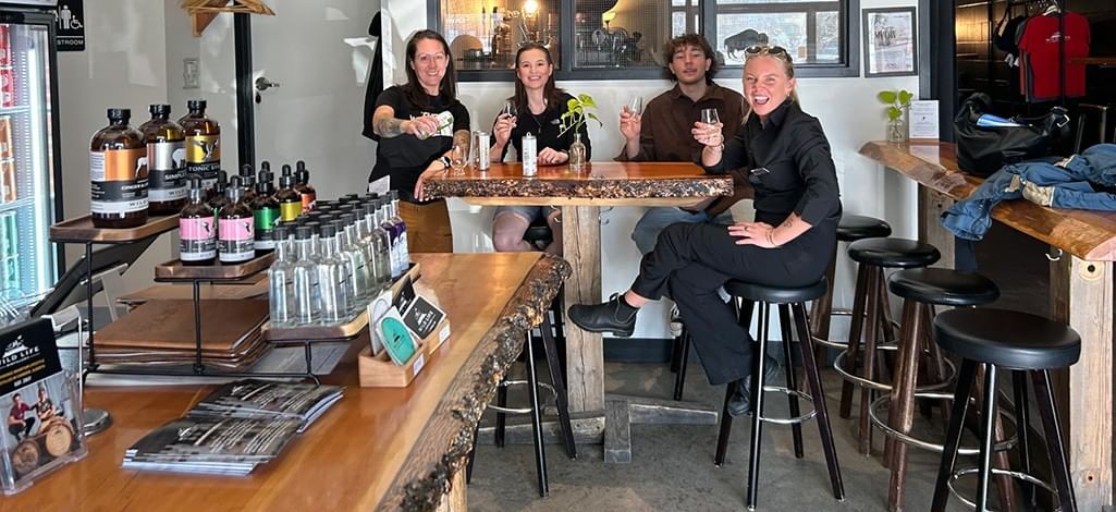 A group enjoys a drink at Wild Life Distillery in Canmore