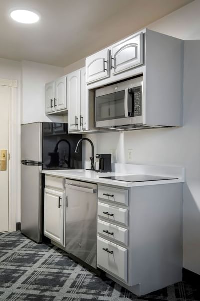 Kitchen with stovetop and fridge at Hotel at Old TOwn