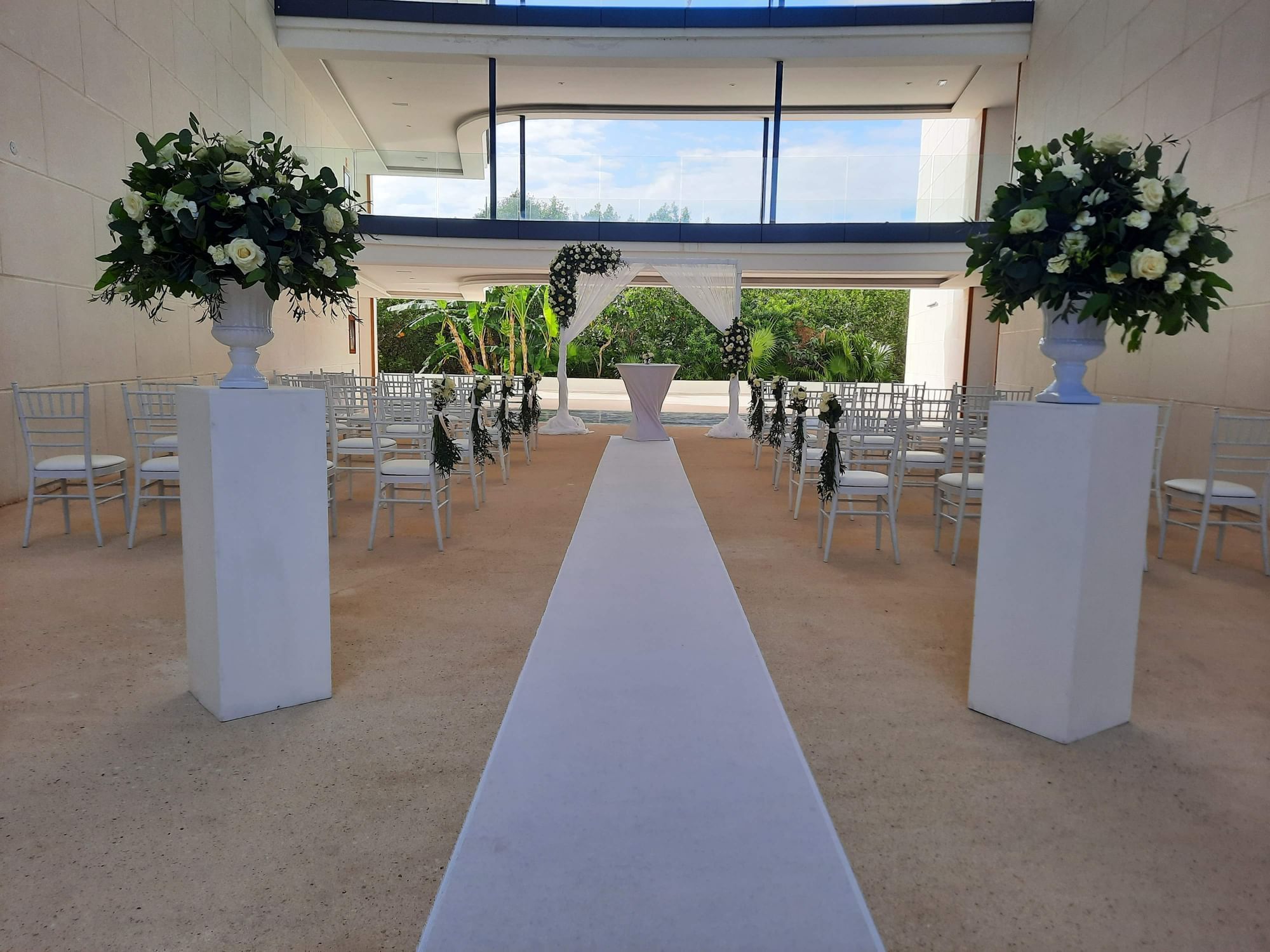Indoor wedding reception, aisle runner & fresh flower decorations in The H at Haven Riviera Cancun