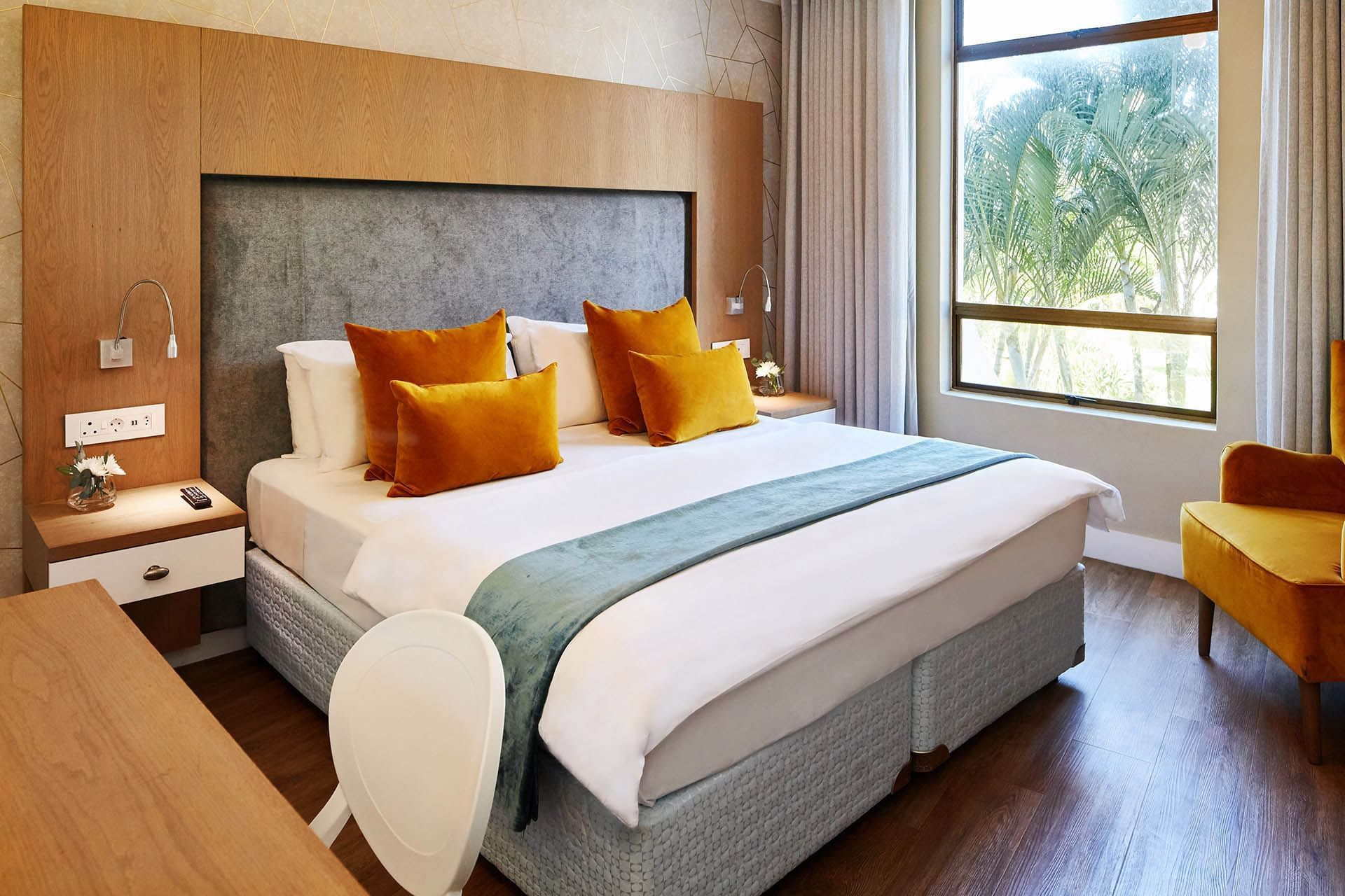 King bed in 2 Bedroom Garden Apartment at First Breakers Resort