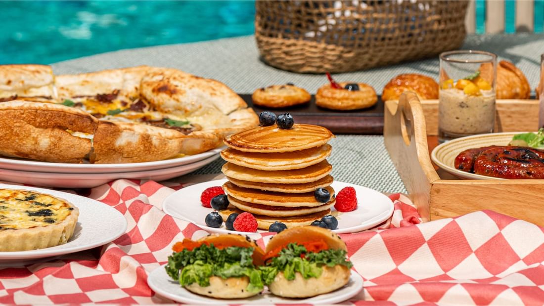 Pancakes with breakfast dishes served on a table at Sunway Resort