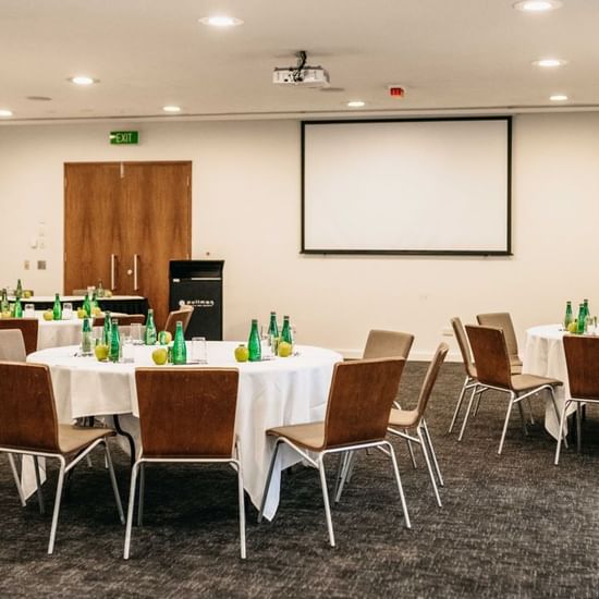 Arranged round tables at Pullman Palm Cove Sea Temple Resort