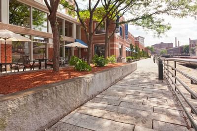 Exterior view of the outdoor dining area at UMass Lowell Inn