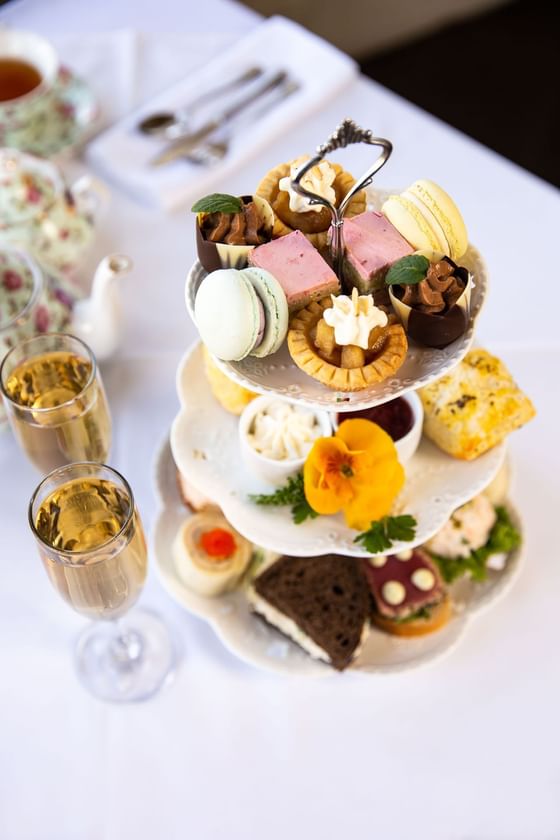 Spread of afternoon tea platter served with beverages in Pendray Tea House at Huntingdon Manor