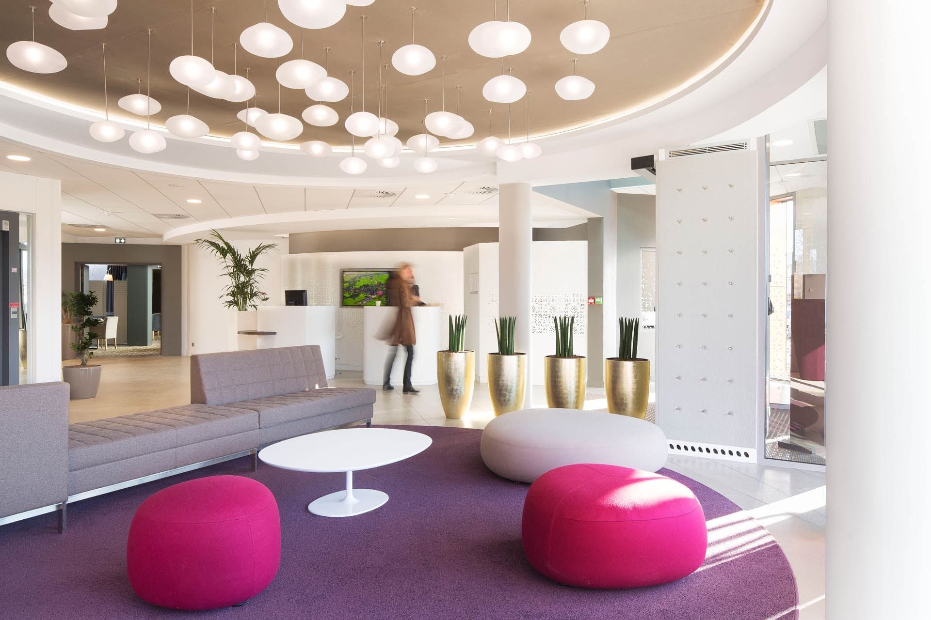 Lobby area with poufs & comfy sofas at Oceania Rennes