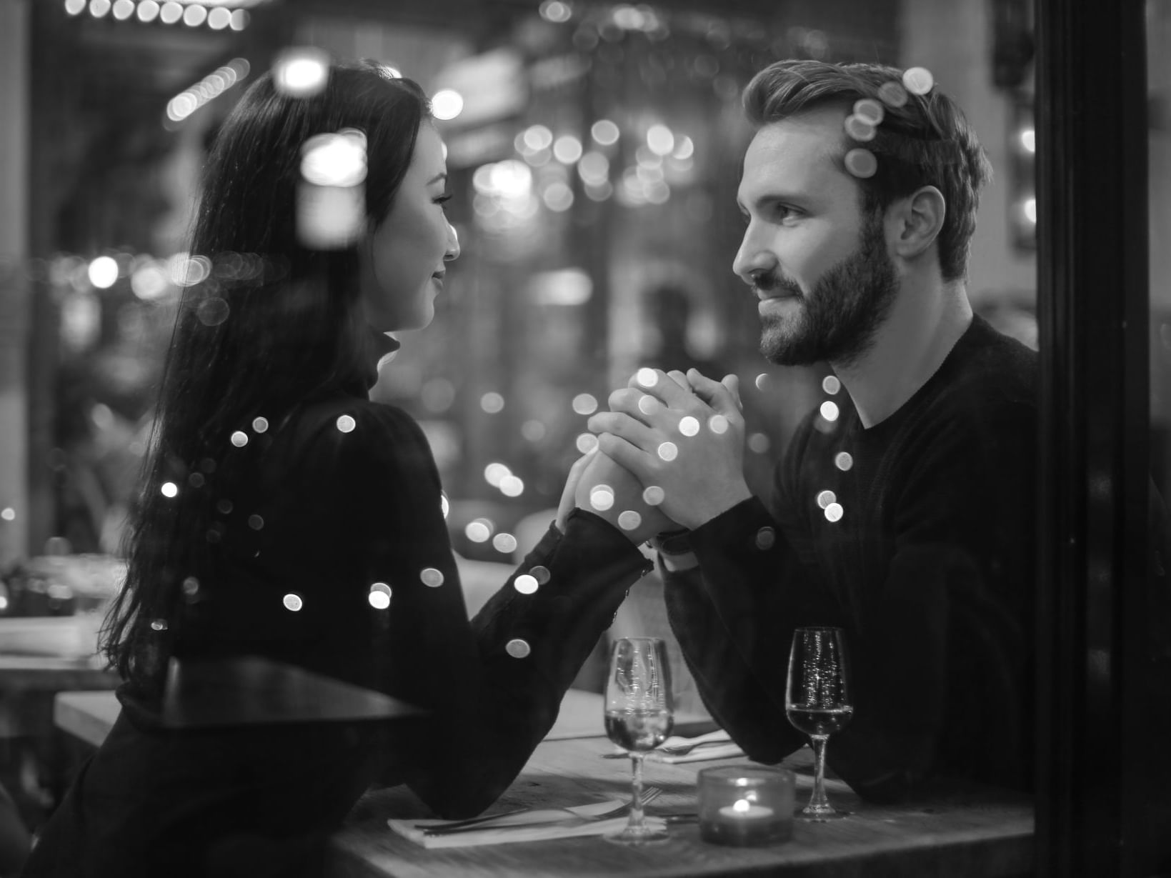 Well-dressed couple looking at each other at The Malcolm Hotel