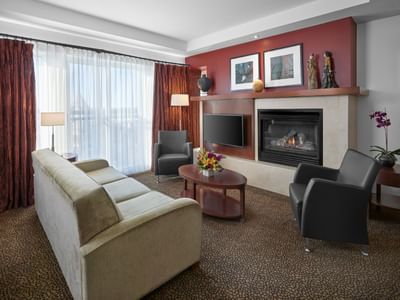 King Suite Lounge with a fireplace at Metterra Hotel on Whyte