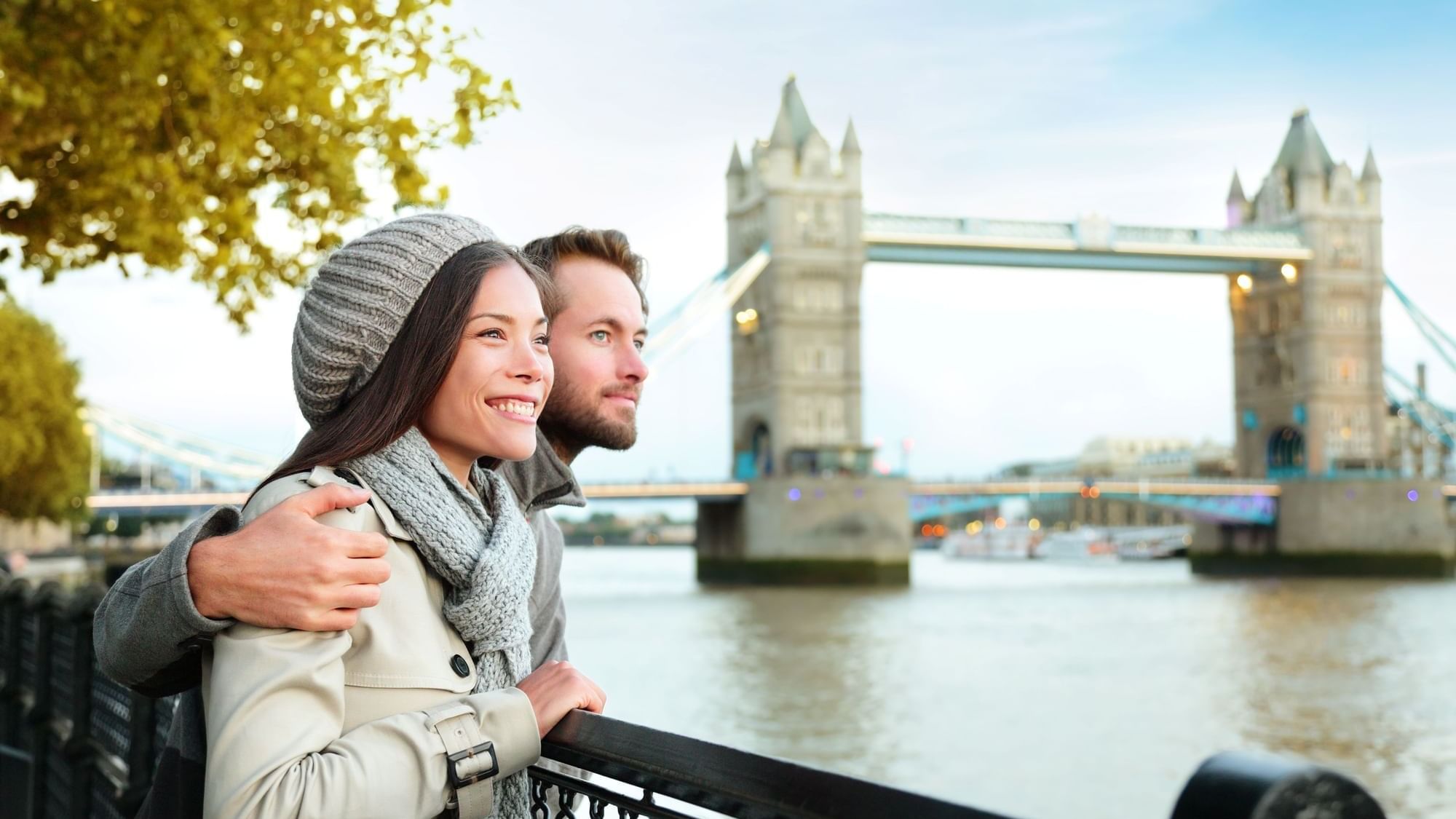 Couple looking out at Tower Bridge