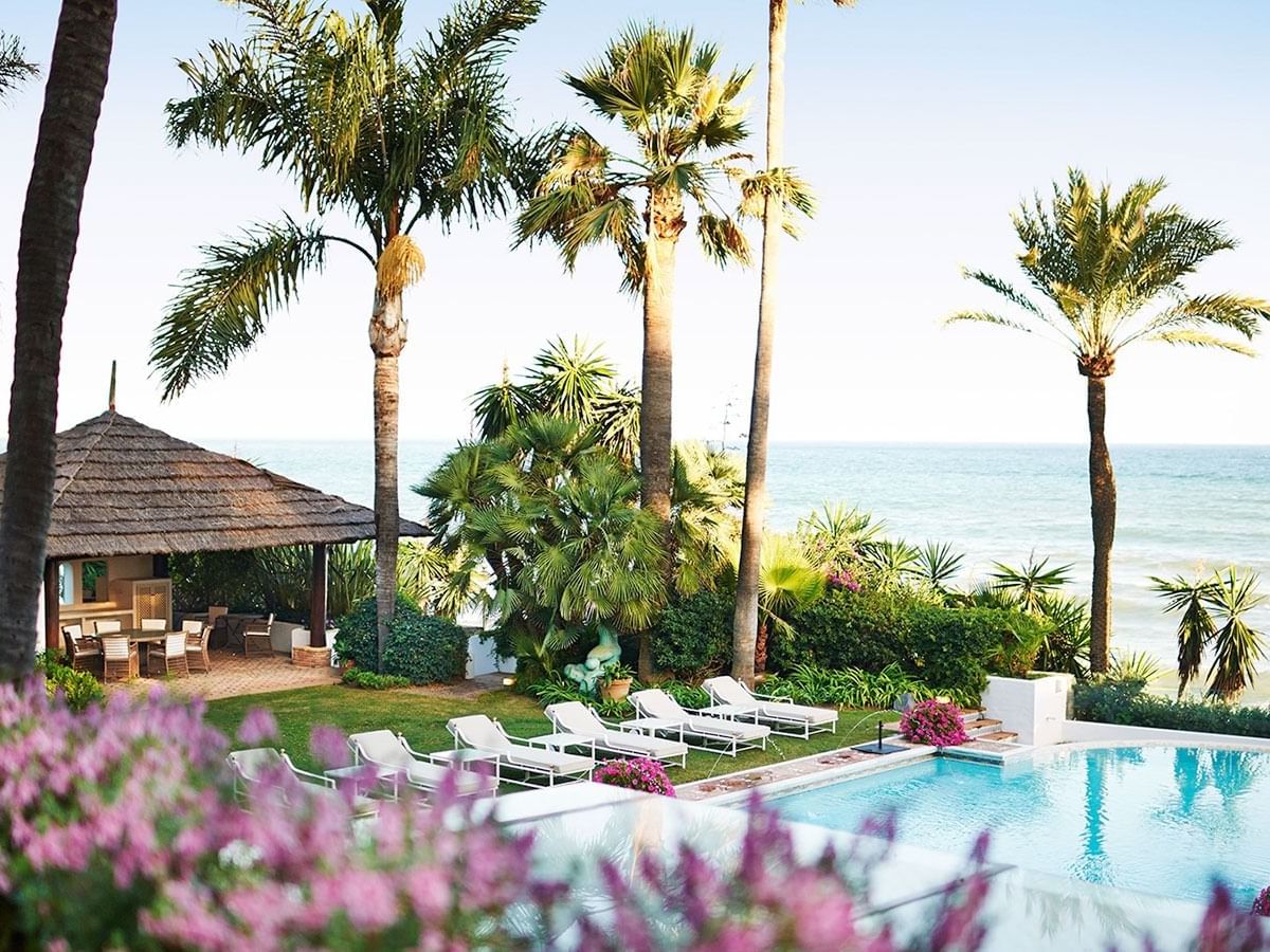 Wide shot of the Outdoor pool with pool beds at Marbella Club