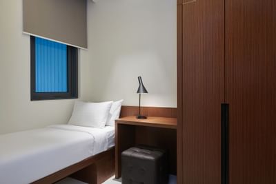 Bed & table lamp in Duo Suite at Tribeca Serviced Suites
