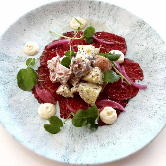 delicious wagyu beef carpaccio with potato and beetroot